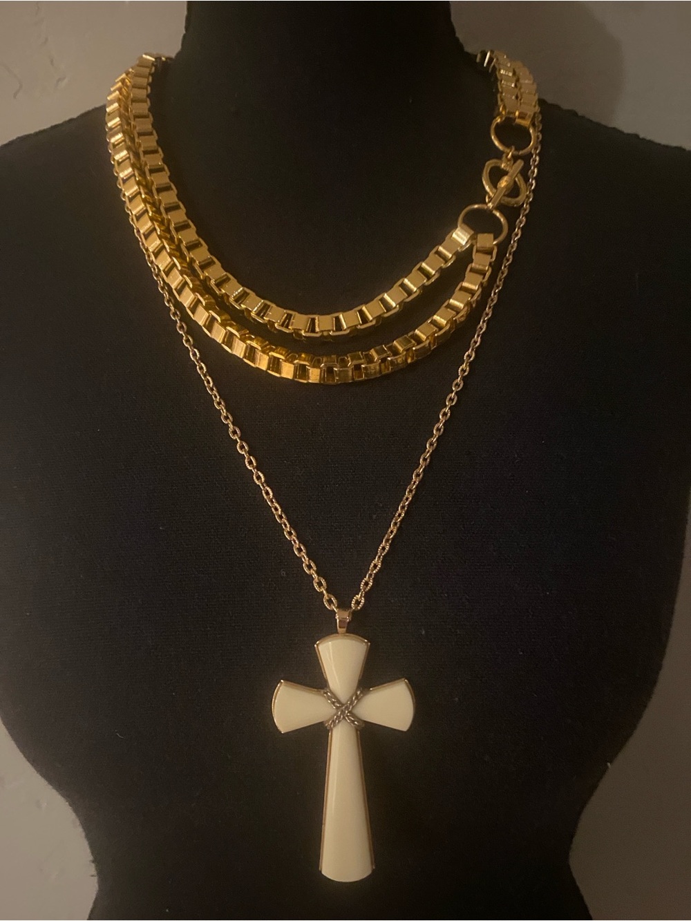 Vintage Avon necklaces. Gold layered piece and cream cross pendant on chain EUC
